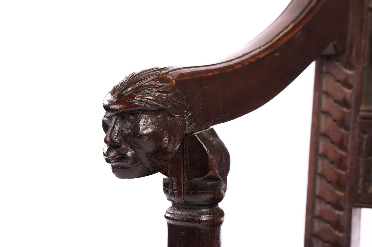An oak wainscot armchair, 17th century and later, with carved decoration, the arms terminating in ca - Image 6 of 26