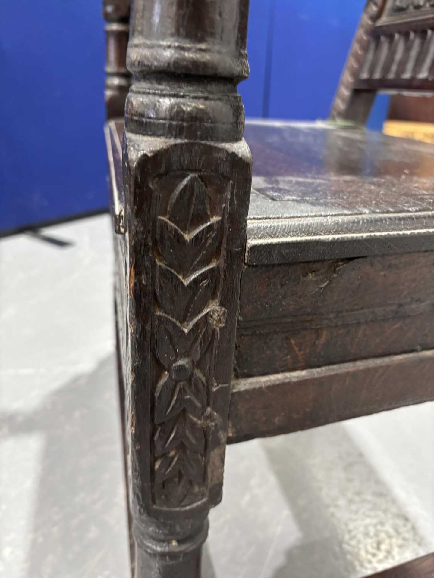 An oak wainscot armchair, 17th century and later, with carved decoration, the arms terminating in ca - Image 25 of 26