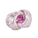 A pink sapphire and diamond cocktail ring of knot design, circa 1960s, centred with a navette-shaped