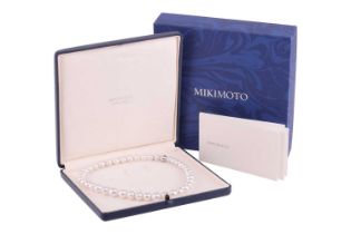 Mikimoto - a single-strand South Sea pearl with a diamond-set clasp, comprising a row of graduated p