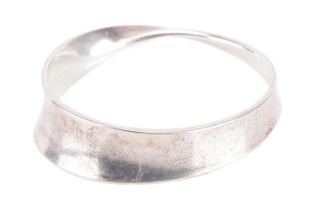 Georg Jensen - a 'Möbius' closed bangle, constructed with a tapering and slightly concave strip,