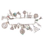 An Art Deco gem-set charm bracelet, two signed Cartier; composed of a series of cable and bar links,