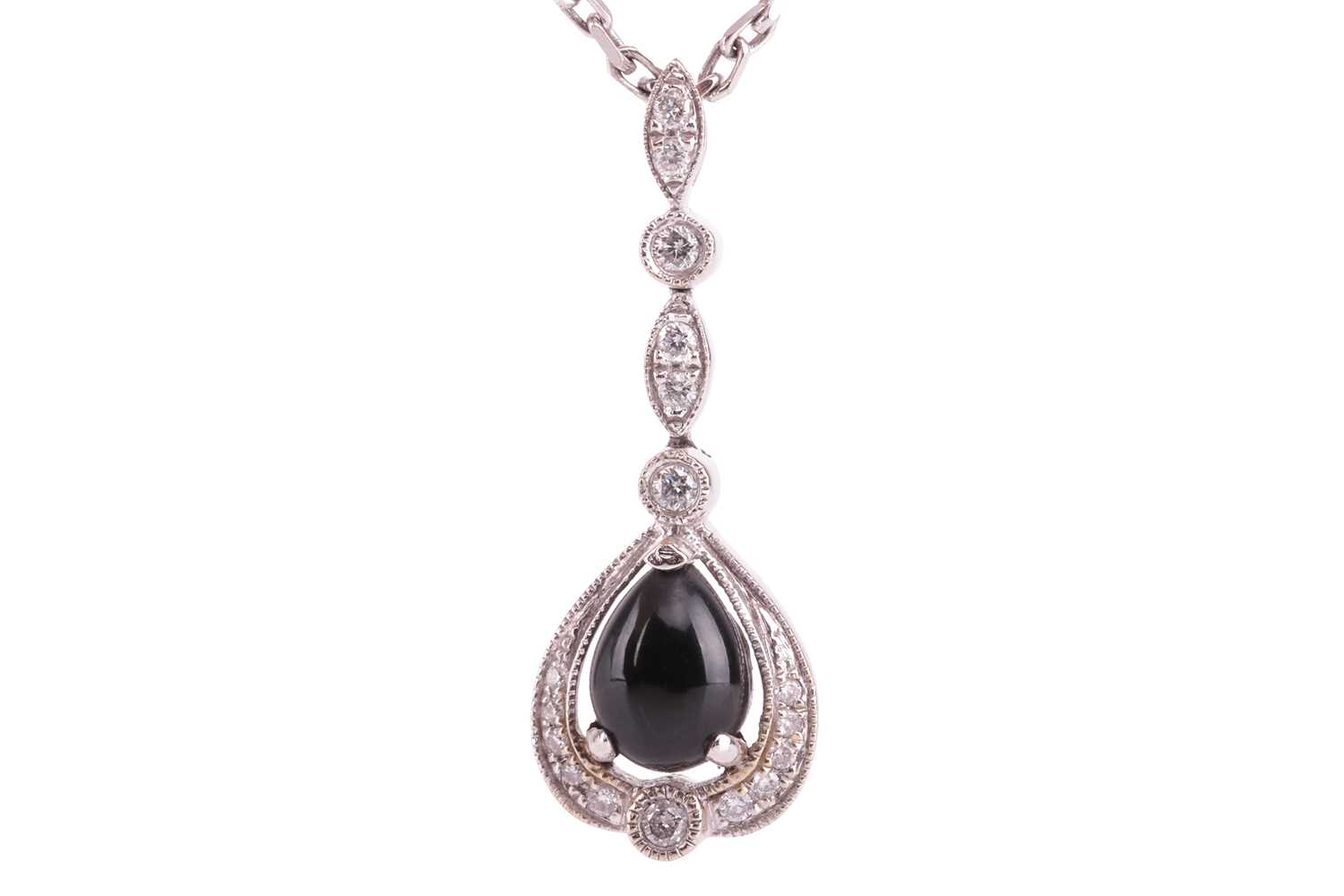 A jet and diamond-set drop pendant, the pear-shaped jet cabochon in a diamond-set mount with millegr
