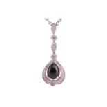 A jet and diamond-set drop pendant, the pear-shaped jet cabochon in a diamond-set mount with millegr