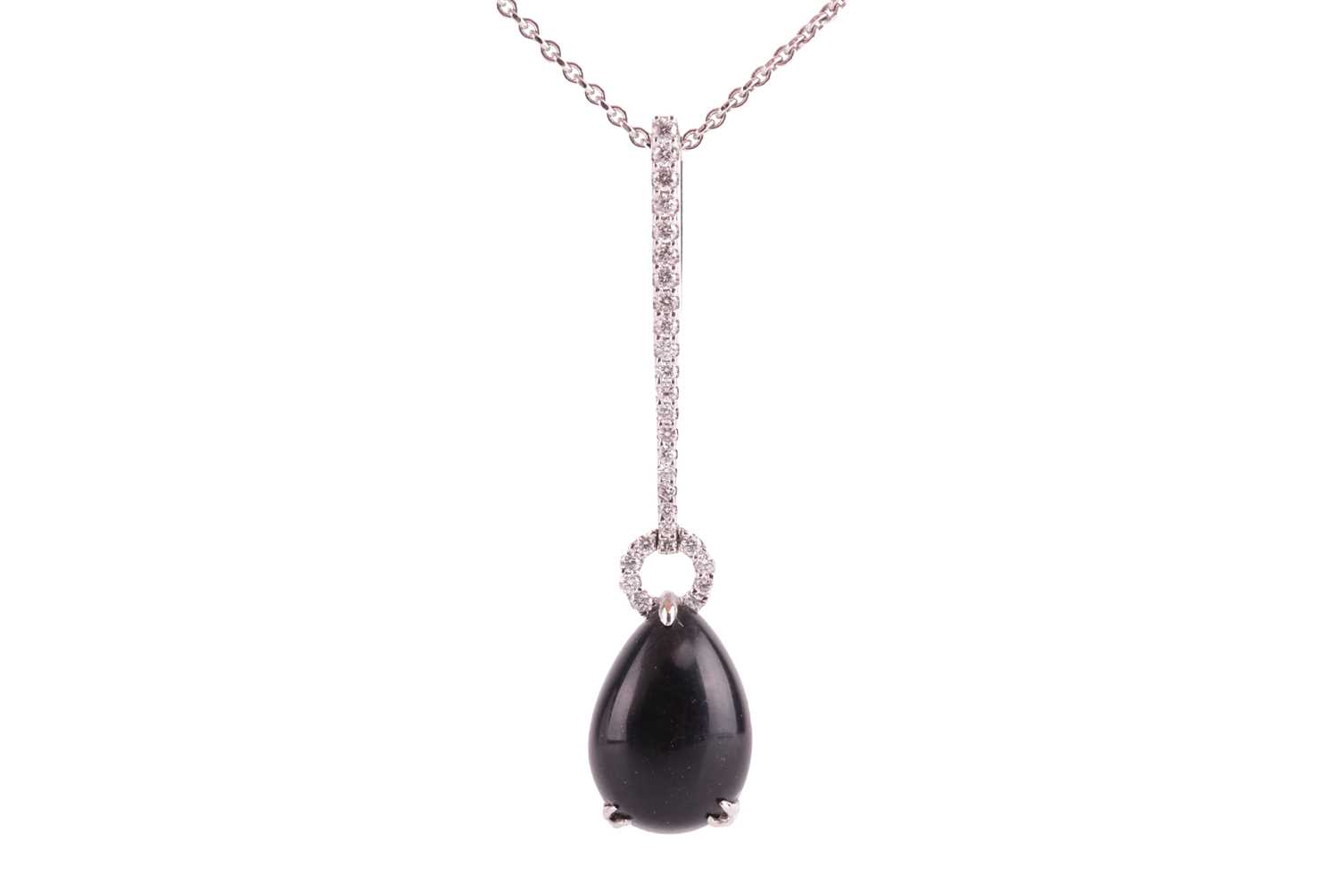A Whitby jet and diamond drop pendant on chain, featuring a teardrop-shaped jet cabochon of 13.0 x 9