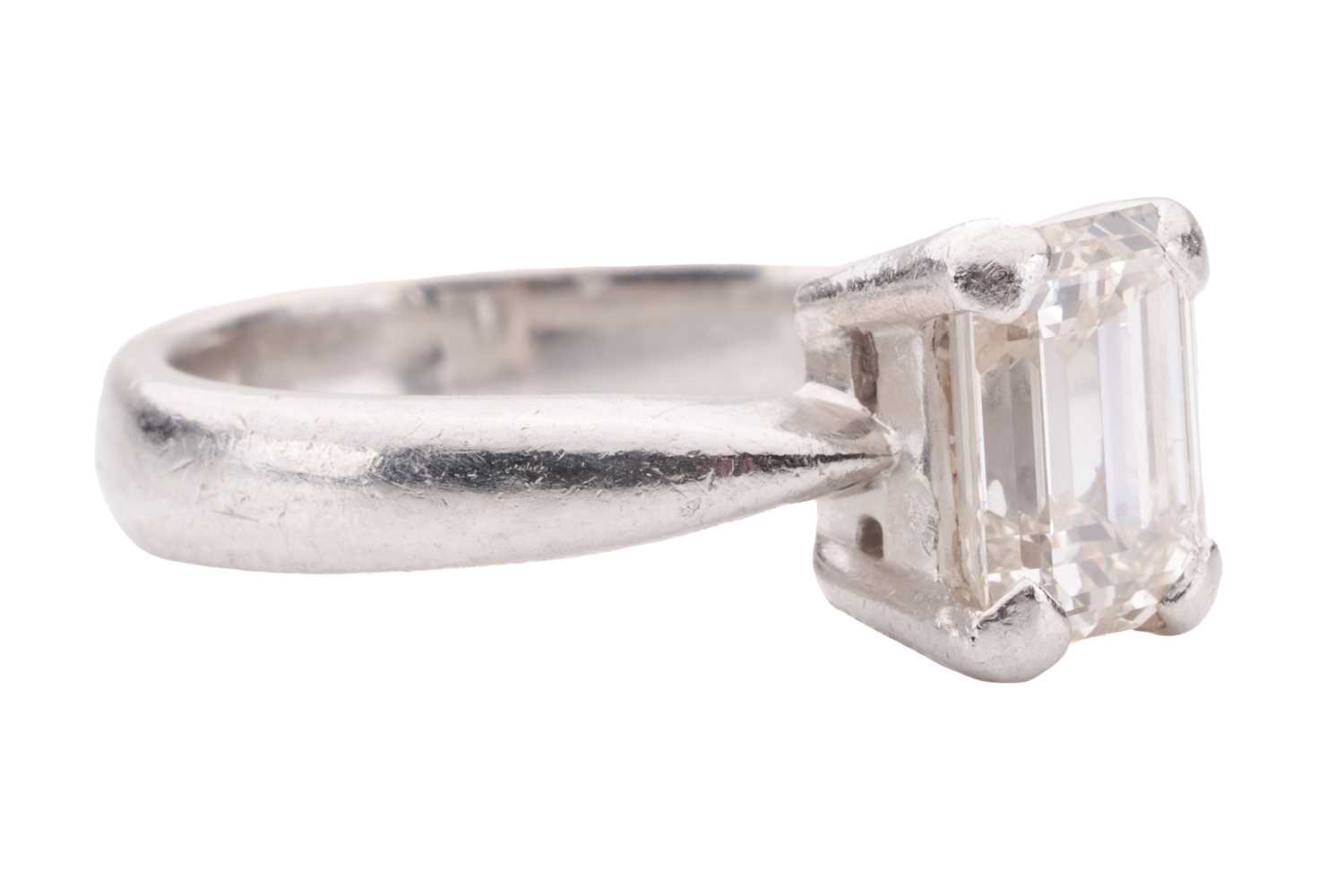 A diamond solitaire ring, set with an emerald-cut diamond with an estimated weight of 1.20ct, in a c - Image 2 of 4