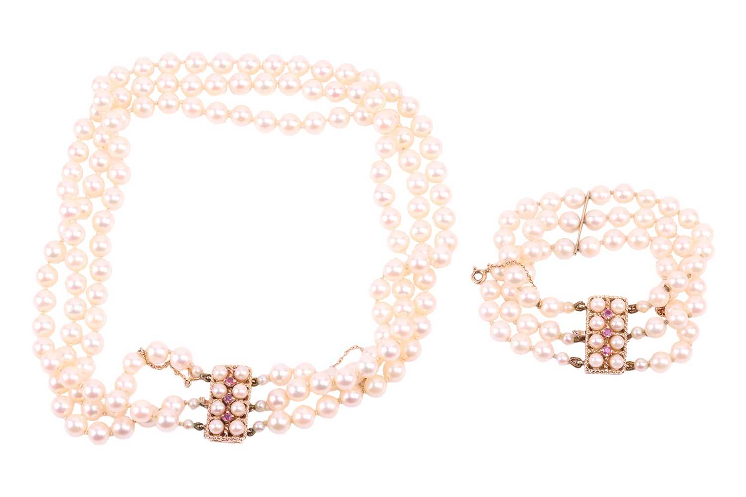A three-strand pearl choker necklace and matching bracelet, the cultured pearls of cream body colour