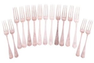 A collection of silver flatware comprising a set of eleven two-pronged table forks and four two-pron