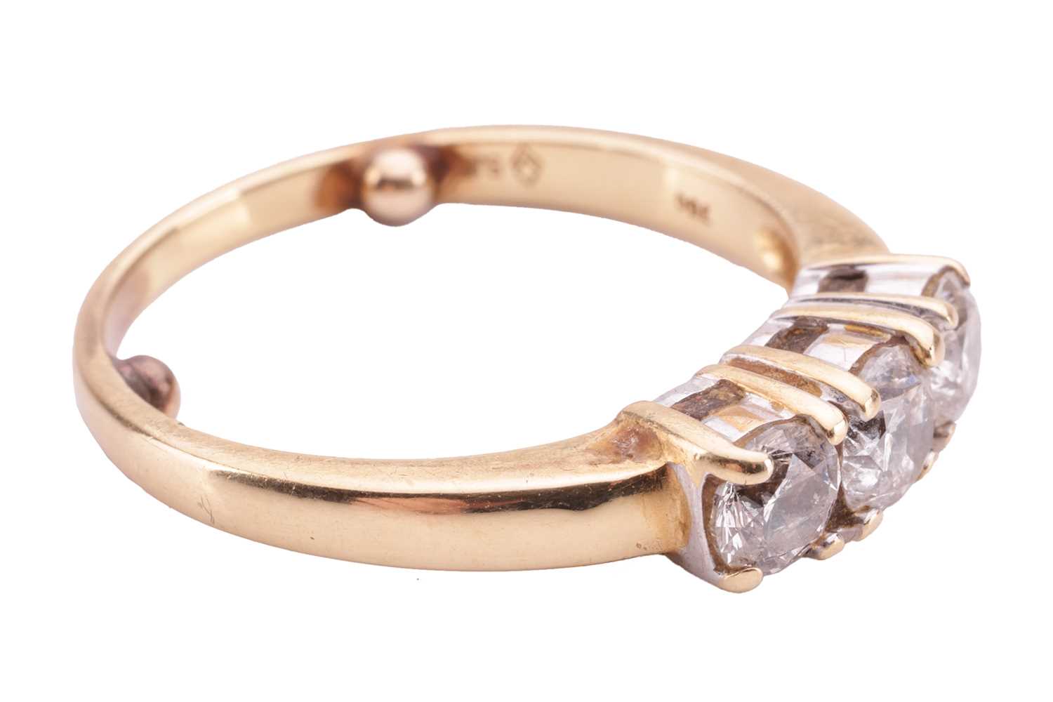 A diamond three-stone ring, claw-set with three round brilliant diamonds, the central stone measurin - Image 3 of 4