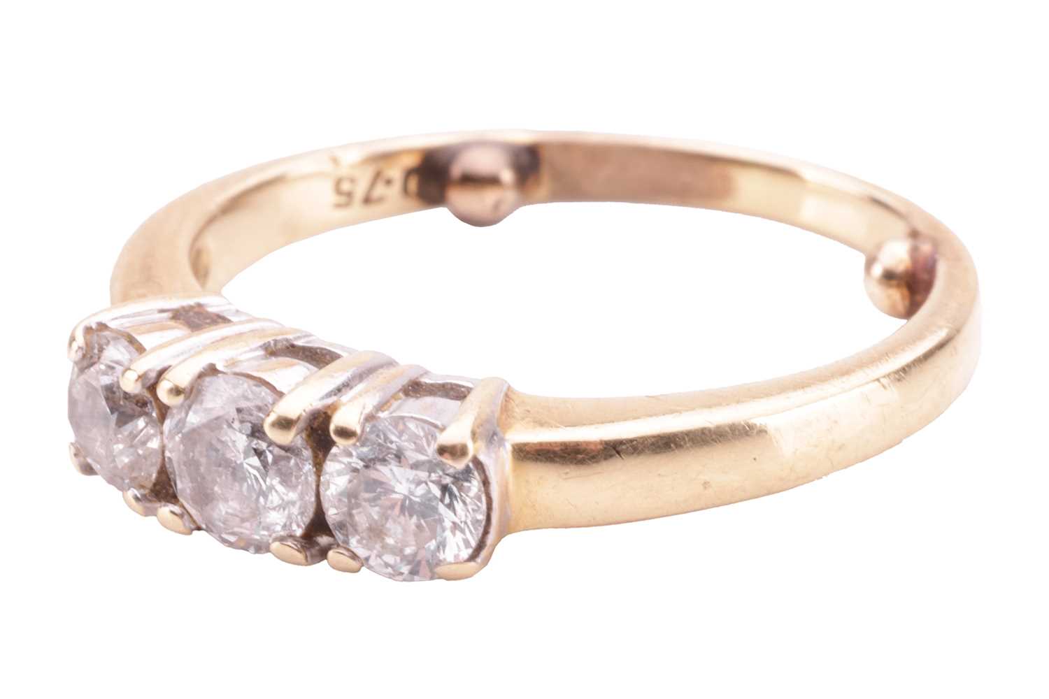 A diamond three-stone ring, claw-set with three round brilliant diamonds, the central stone measurin - Image 2 of 4