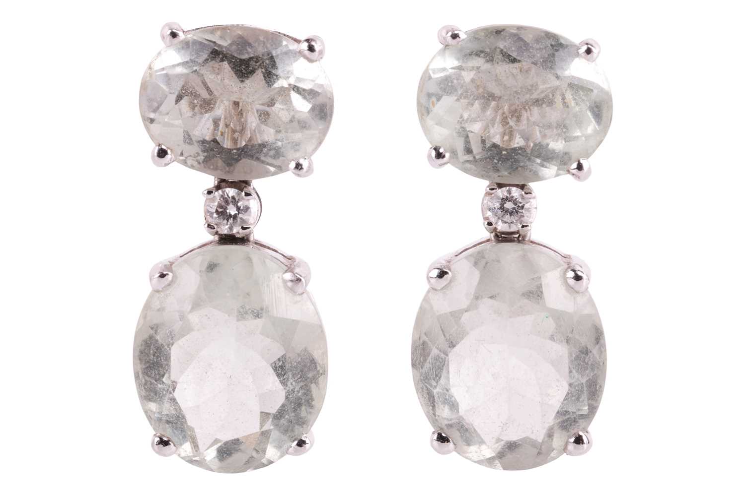 A pair of prasiolite and diamond earrings, each earring set with two oval prasiolite with a brillian