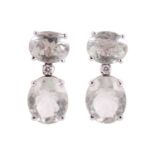 A pair of prasiolite and diamond earrings, each earring set with two oval prasiolite with a brillian