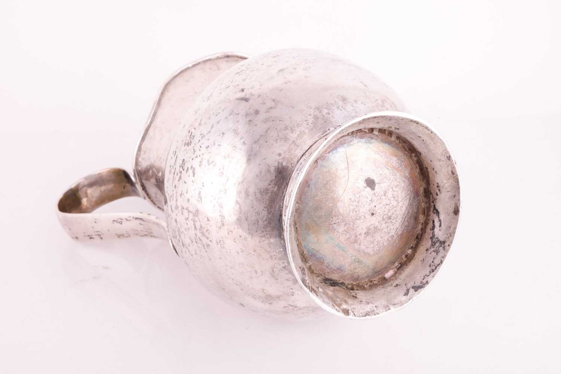 A white metal jug possibly Bolivian of baluster form with a tapered loop handle and flared foot, 23  - Image 3 of 3