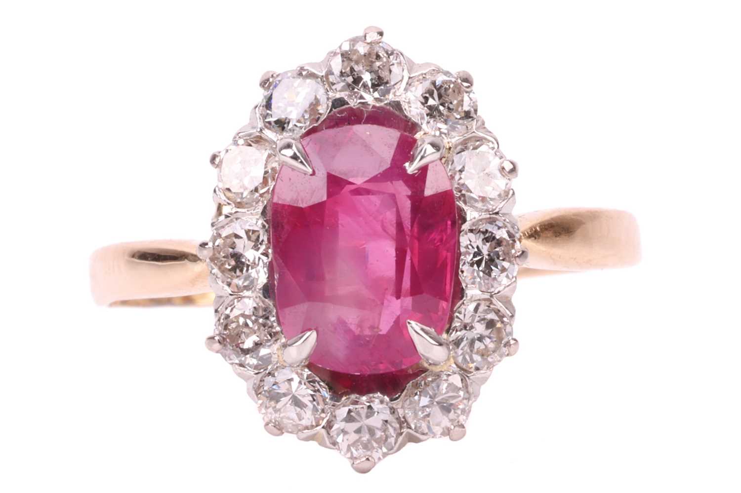 An unheated Burmese ruby and diamond entourage ring, centred with a cushion-cut ruby of 1.37ct, appr