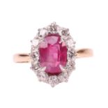 An unheated Burmese ruby and diamond entourage ring, centred with a cushion-cut ruby of 1.37ct, appr