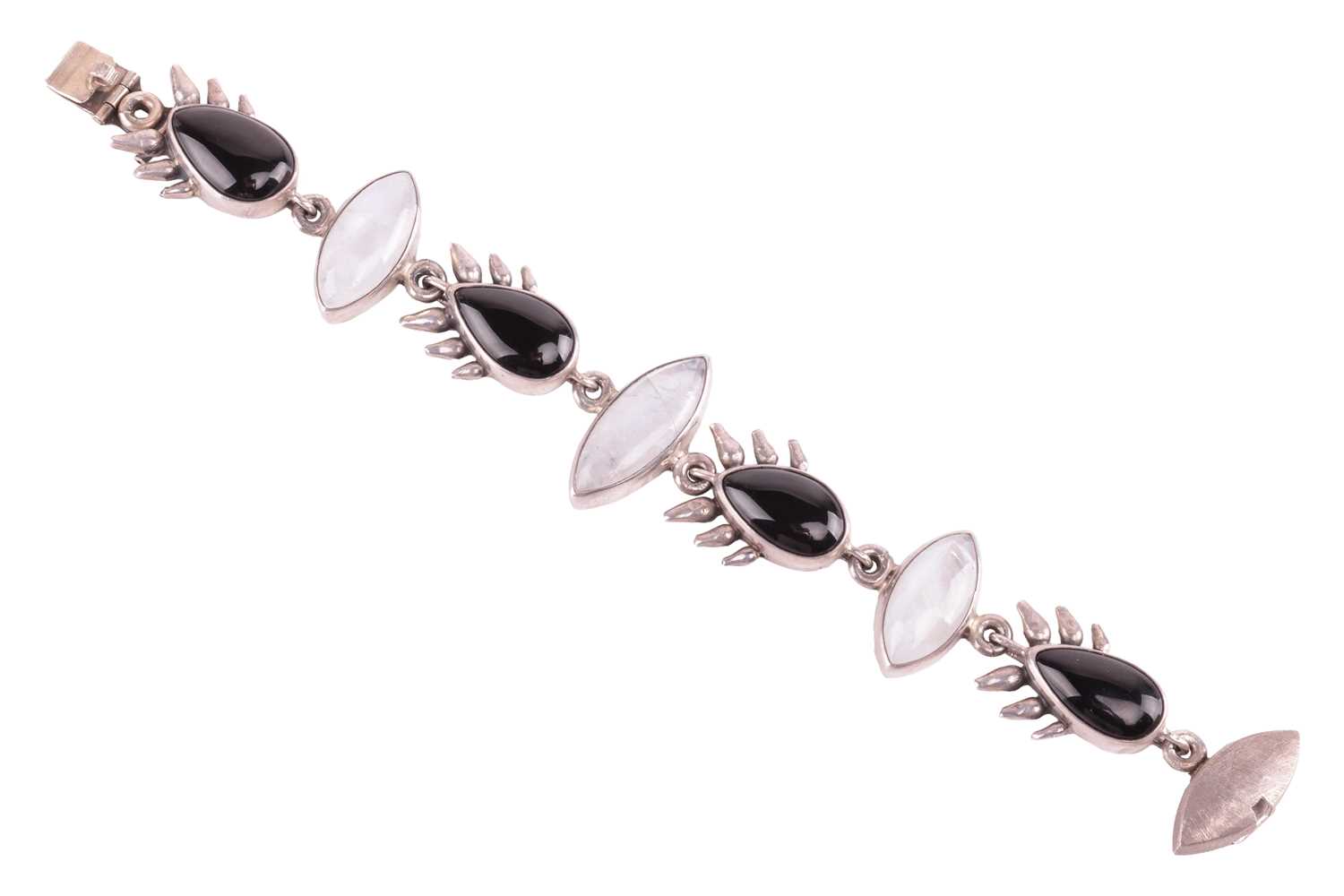 A Whitby jet and labradorite link bracelet in silver, comprising four pear-shaped jets flanking thre