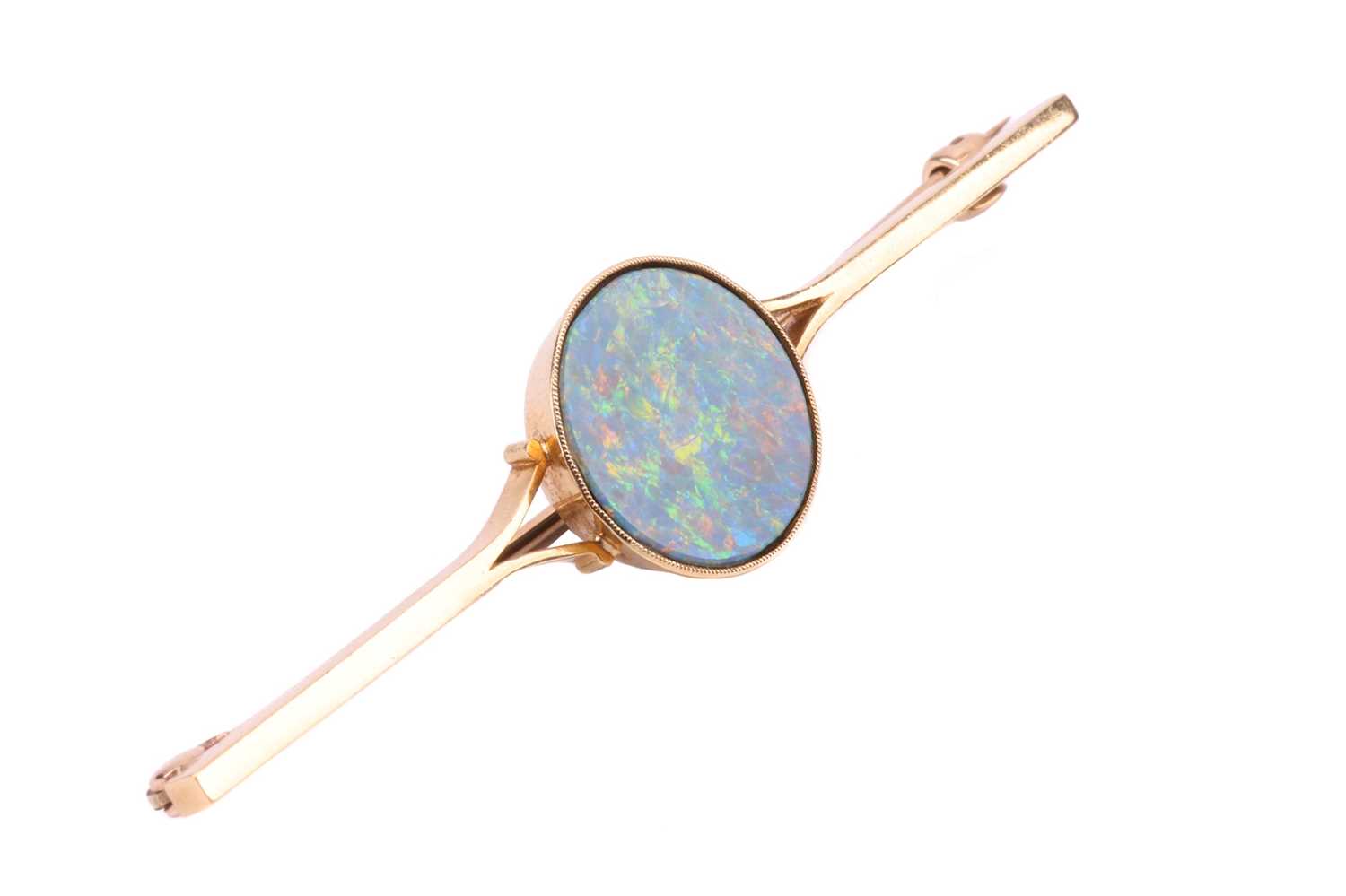 A bar brooch set with a round opal doublet, approximately measures 14.0 mm across, displaying strong - Image 3 of 3