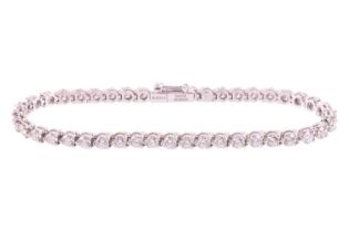 A diamond line bracelet by David Morris, claw set with 44 round brilliant diamonds measuring