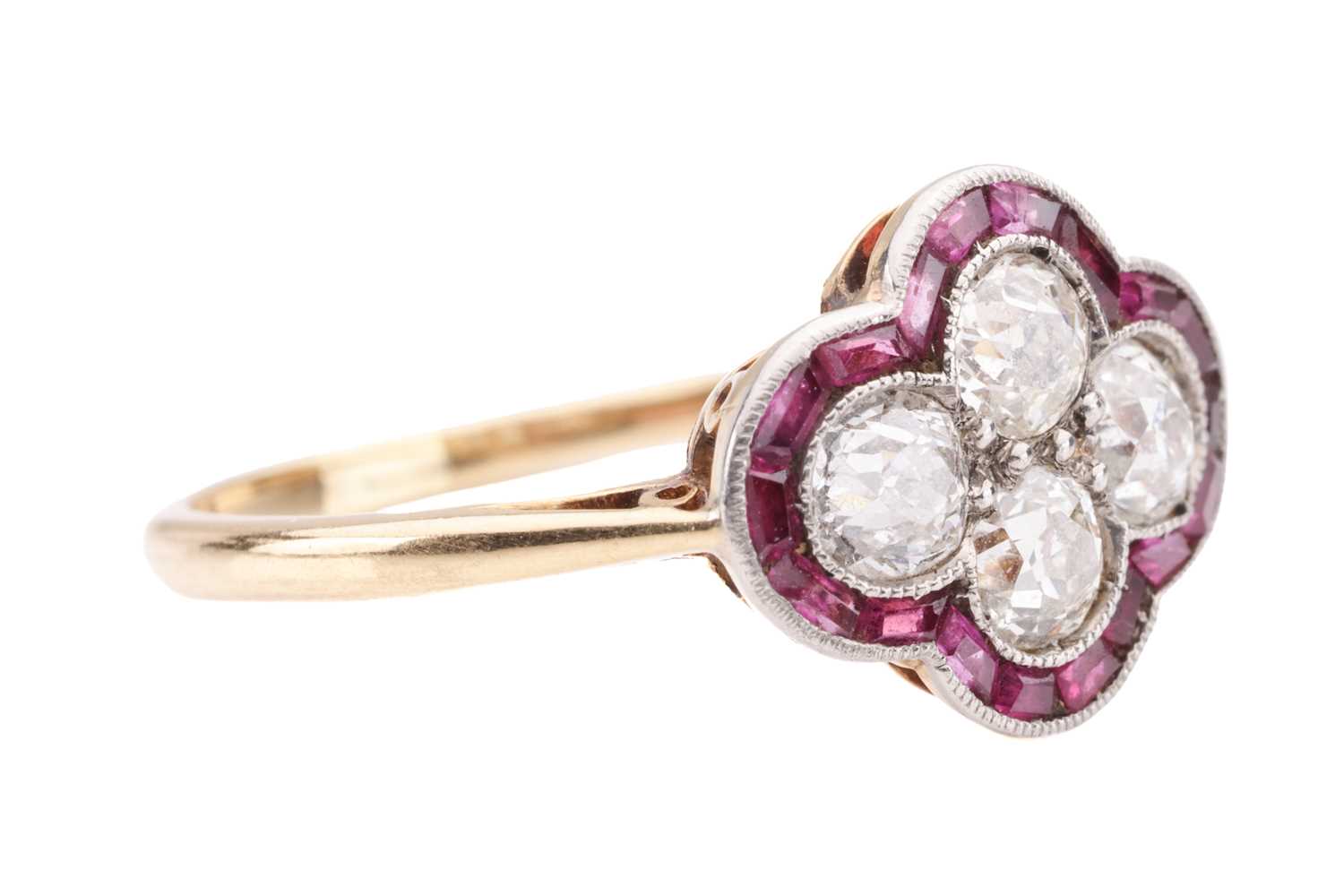 An Art Deco diamond and ruby quatrefoil ring, the panel is constructed by four old-cut diamonds with - Image 4 of 4