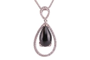 A jet and diamond-set pendant, featuring a pear-shaped jet cabochon, in a diamond-set open drop 18ct