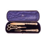 A cased set of late Victorian fruit servers, comprising a knife and fork, and a pair of grape scisso