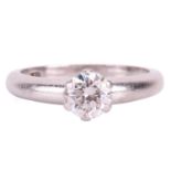 A diamond solitaire ring, with a round brilliant cut diamond measuring approximately 5.1mm, with an 