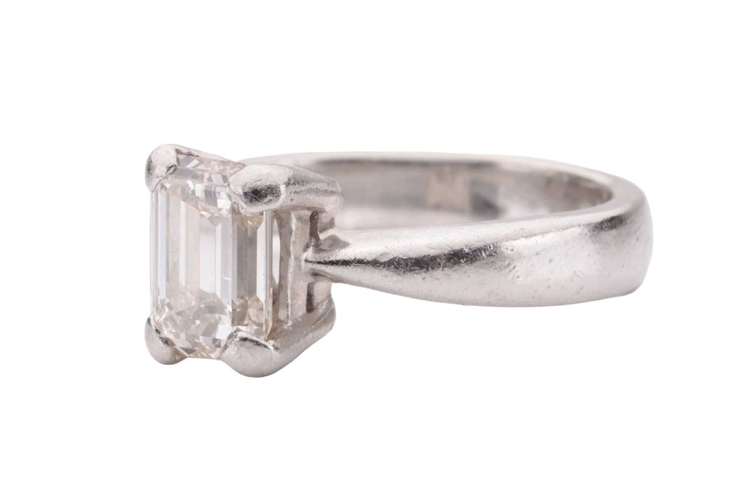 A diamond solitaire ring, set with an emerald-cut diamond with an estimated weight of 1.20ct, in a c - Image 3 of 4