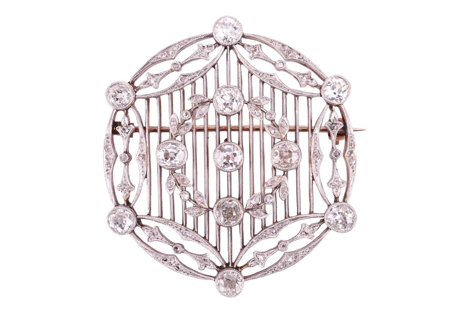 An Edwardian diamond brooch circa 1910, designed in a circular lattice design, with an applied garla