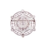 An Edwardian diamond brooch circa 1910, designed in a circular lattice design, with an applied garla