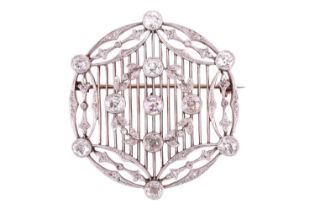 An Edwardian diamond brooch circa 1910, designed in a circular lattice design, with an applied