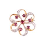 A ruby and diamond brooch, designed as a stylised flower set with rubies, with single cut diamonds s