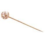 A seed pearl crescent stick pin, the crescent measuring 11mm diameter, with a seed pearl trefoil clu