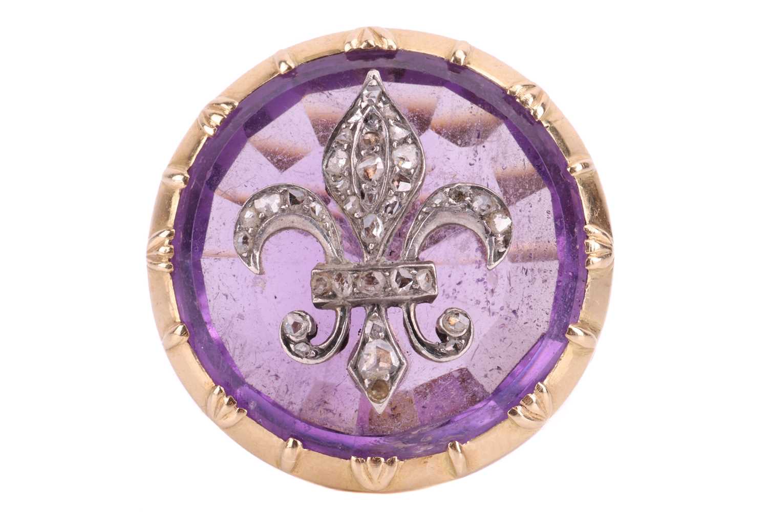 An amethyst fleur-de-lis cocktail ring, the fleur-de-lis emblem set with rose cut diamonds and mount