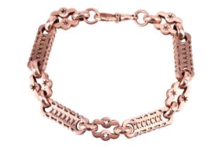 A fancy link bracelet in 9ct rose gold, hollow links with pierced design and a scalloped edge, compl