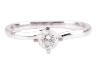 A diamond solitaire ring, featuring a round brilliant cut diamond with a weight of 0.35ct, G colour,