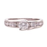 A diamond solitaire ring, the central round brilliant diamond measuring approximately 4.85mm, with a