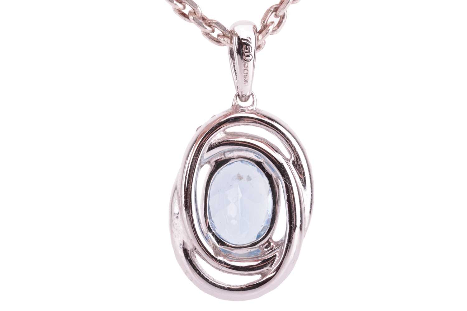 An aquamarine and diamond-set oval pendant, featuring an oval aquamarine, with an estimated carat we - Image 2 of 3