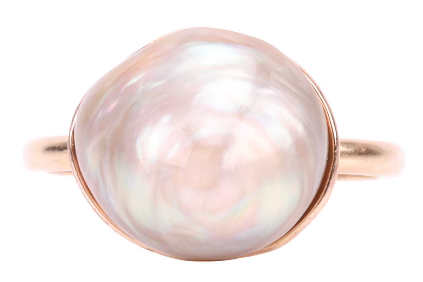 A blister pearl dress ring in 9ct gold, set with an irregularly shaped Baroque blister pearl, with p