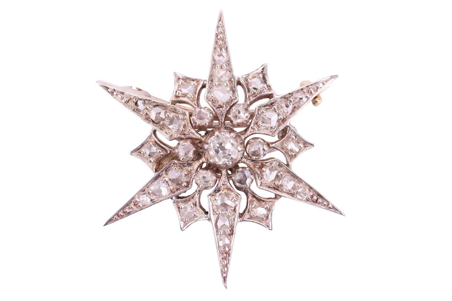 A Victorian star brooch, set throughout with diamonds, the largest central old-cut diamond measuring