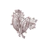 A diamond convertible double-clip spray brooch, each clip with a navette-shaped motif and spray, set