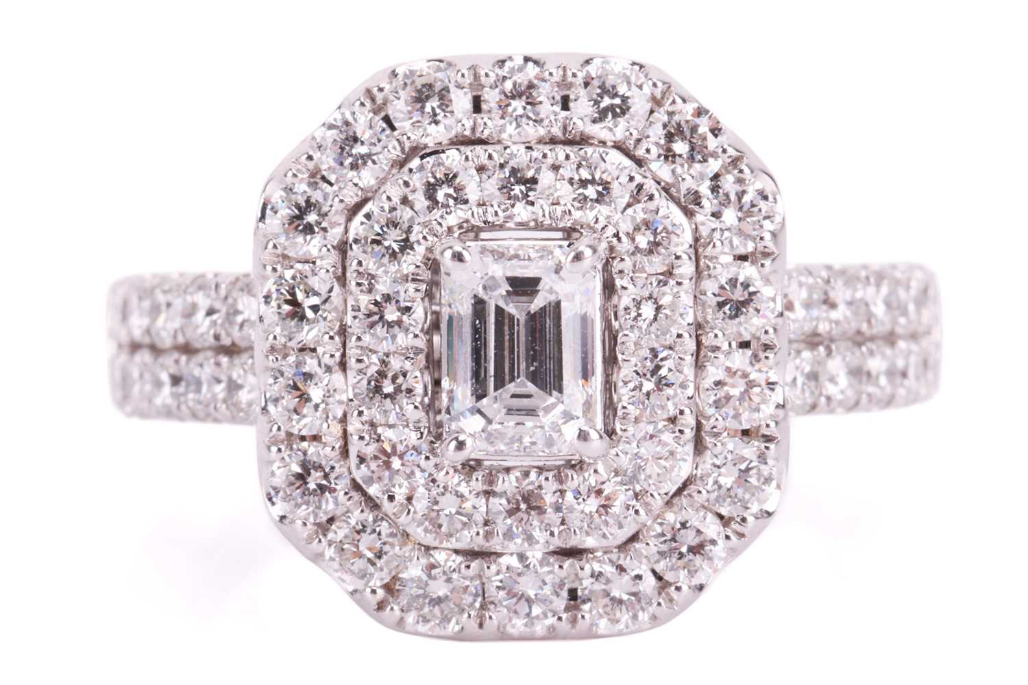 A laboratory-grown diamond cluster ring, featuring an emerald-cut laboratory-grown diamond measuring