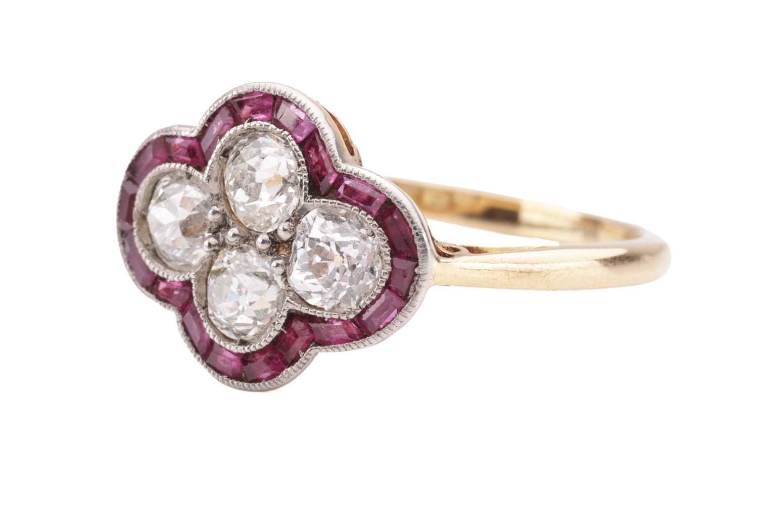 An Art Deco diamond and ruby quatrefoil ring, the panel is constructed by four old-cut diamonds with - Image 2 of 4