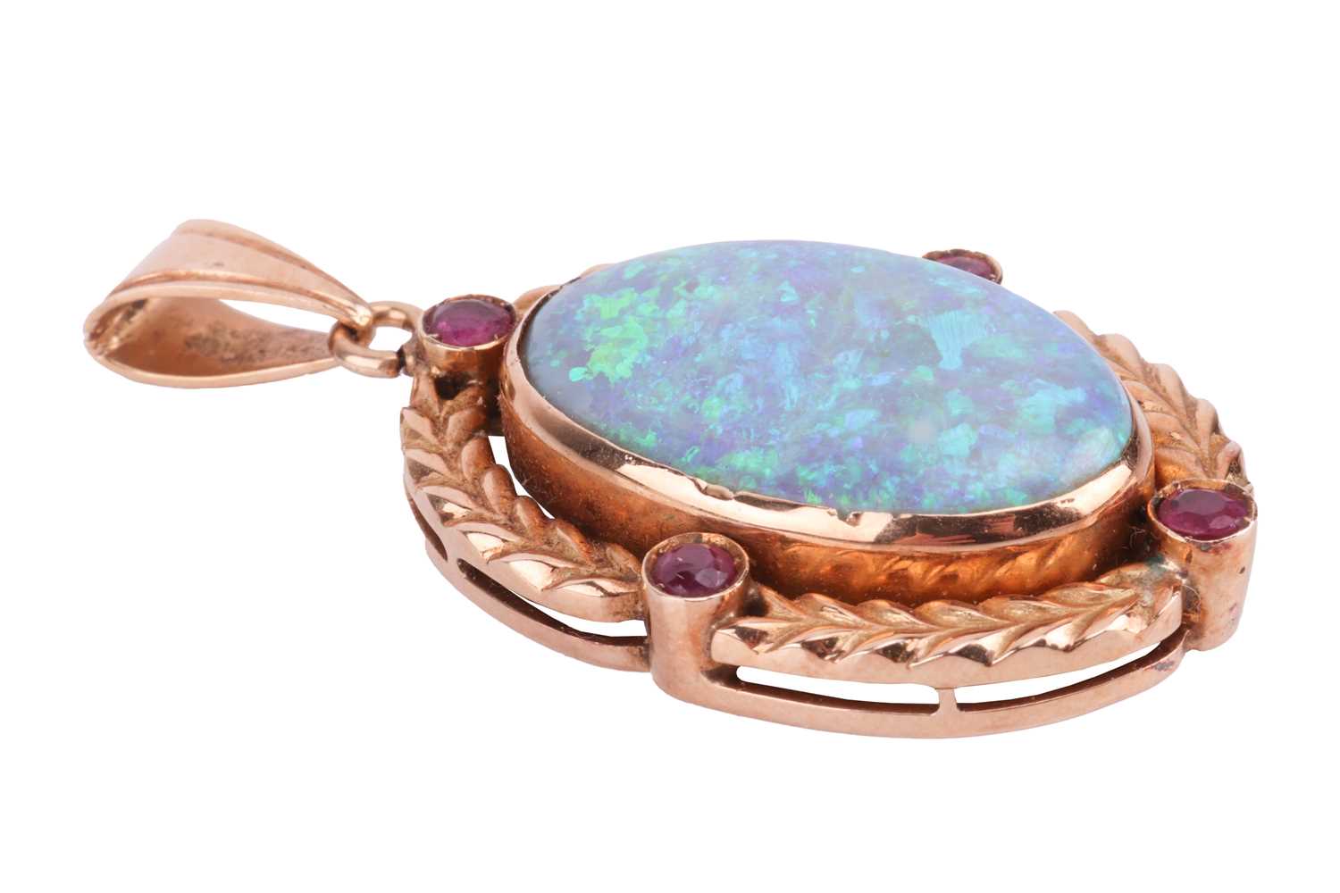 An opal and ruby pendant, featuring a large oval cabochon of a precious opal of 2.4 x 1.5 cm, displa - Image 2 of 3