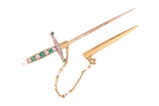A 19th century French emerald, diamond and seed pearl sword jabot pin, set with emeralds and rose cu