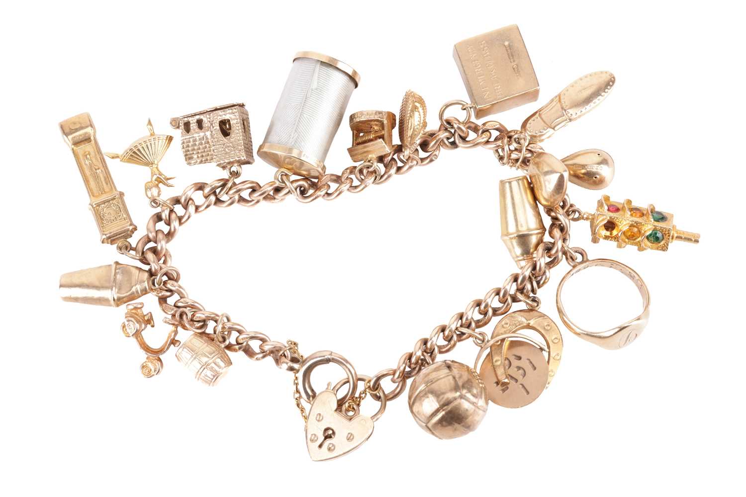 A charm bracelet in 9ct gold, composed of a series of cable links, suspending with nineteen charms, 