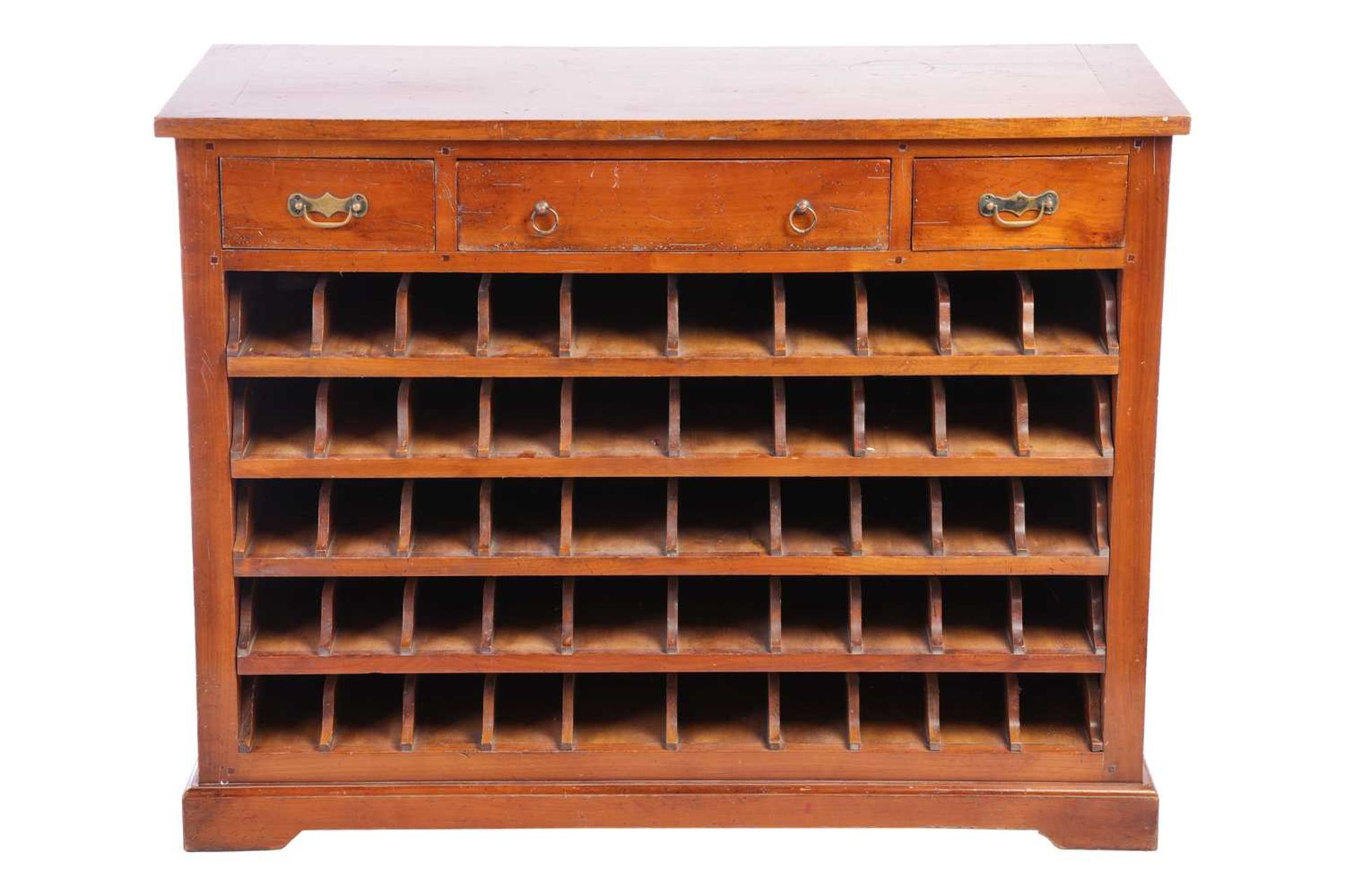 An early 20th-century French cherry wood Sommelier's wine rack, cupboard, fitted with three frieze d