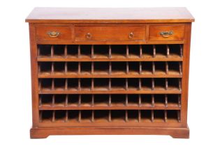 An early 20th-century French cherry wood Sommelier's wine rack, cupboard, fitted with three frieze