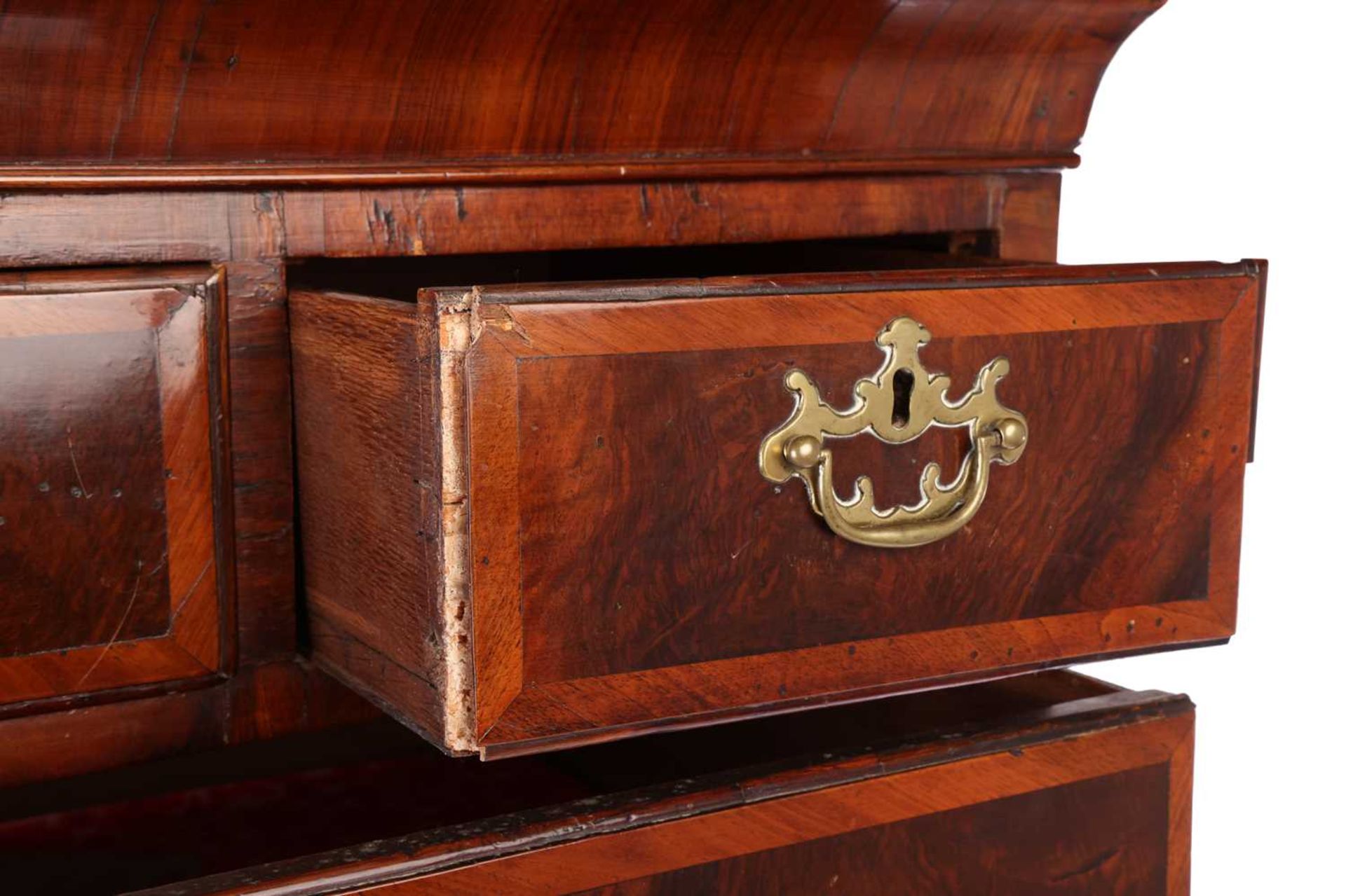A George II walnut chest on stand, with diagonal crossbanding, the cavetto moulded cornice over thre - Bild 7 aus 7