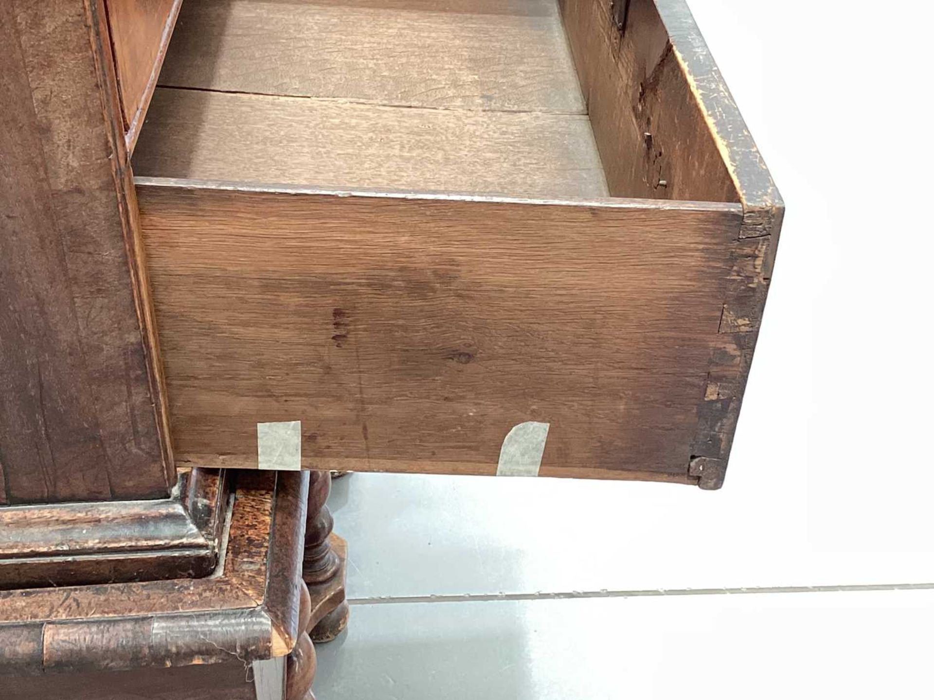 A 17th-century and later figured walnut chest on stand, the upper section with quarter veneered top  - Image 21 of 22
