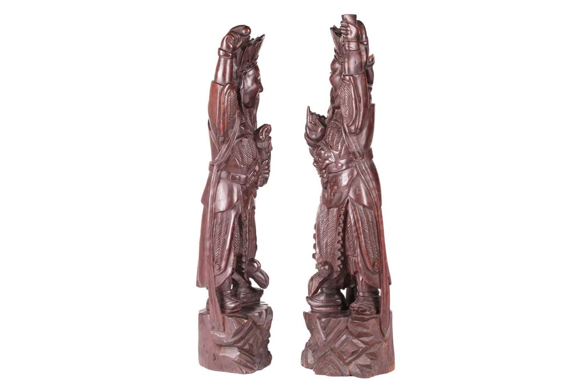 A pair of Chinese carved cherry wood figures of warriors one possibly Xianwu both with inset glass b - Image 3 of 11